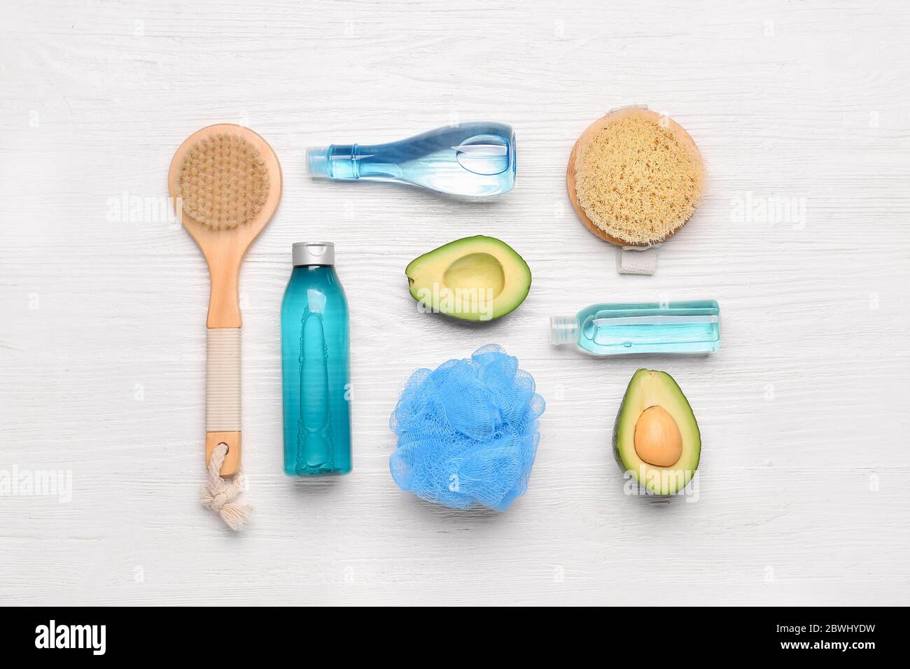 Shower gels with bath supplies on white wooden background Stock Photo