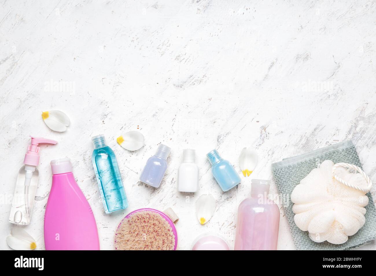 Shower gels with bath supplies on light background Stock Photo Alamy