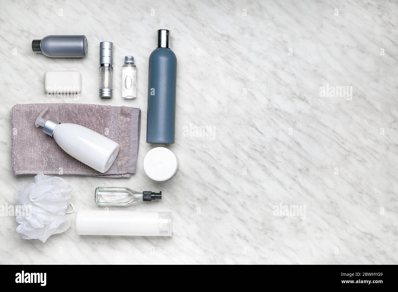 Shower gels with bath supplies on light background Stock Photo Alamy