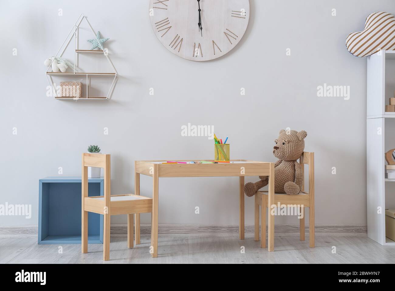 Stylish interior of children's room with table and chairs Stock Photo ...
