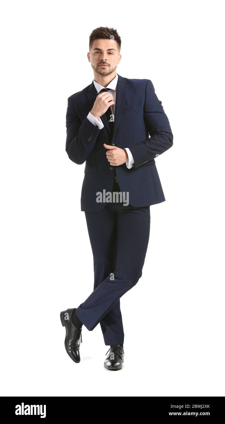 Handsome young man in elegant suit on white background Stock Photo - Alamy