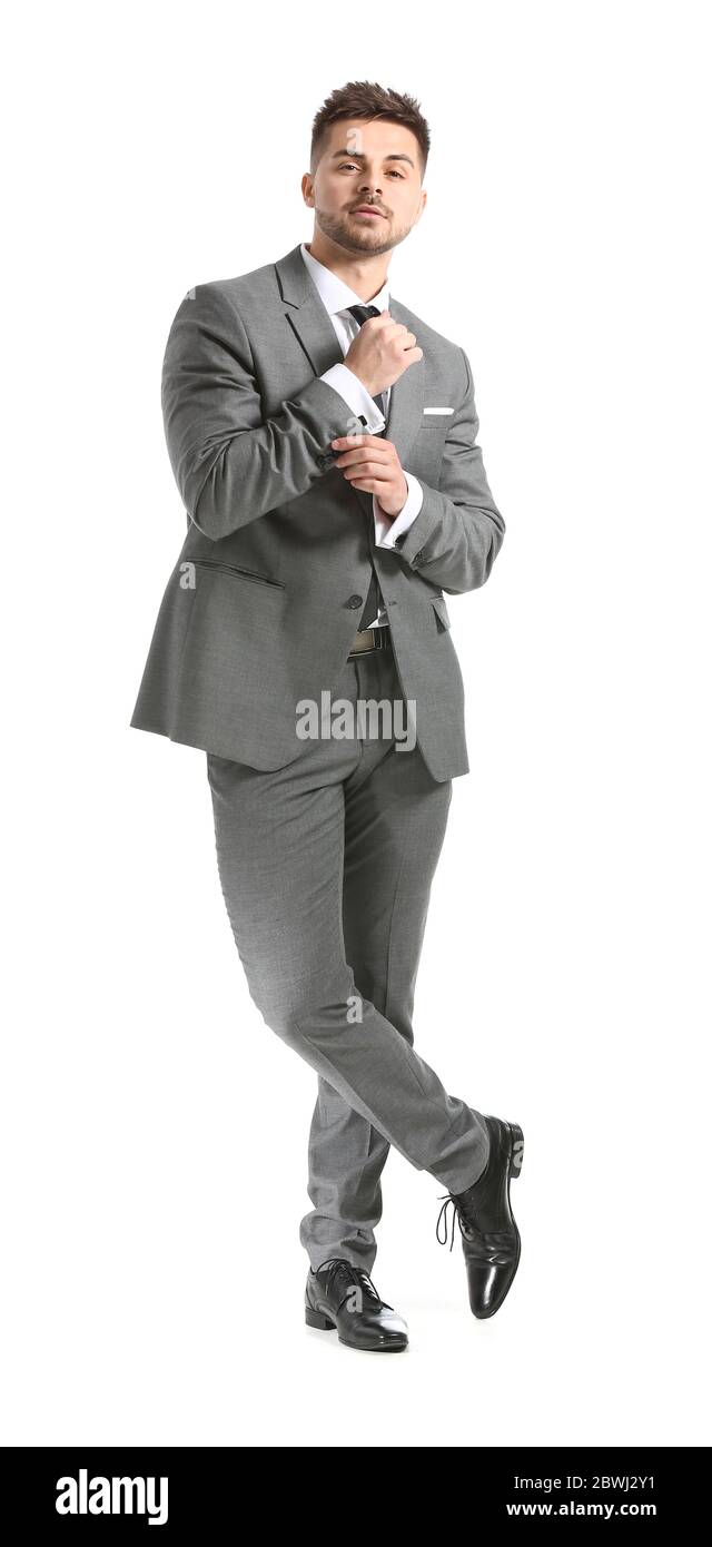 Handsome young man in elegant suit on white background Stock Photo - Alamy