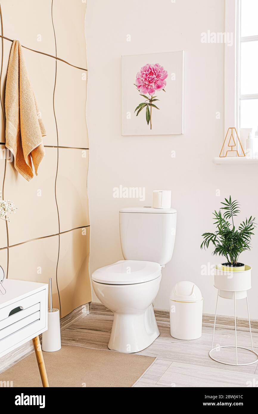 Interior of bathroom with floral decor Stock Photo Alamy