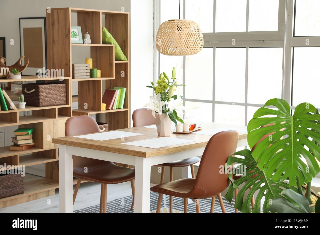 Interior of modern stylish dining room with floral decor Stock Photo ...