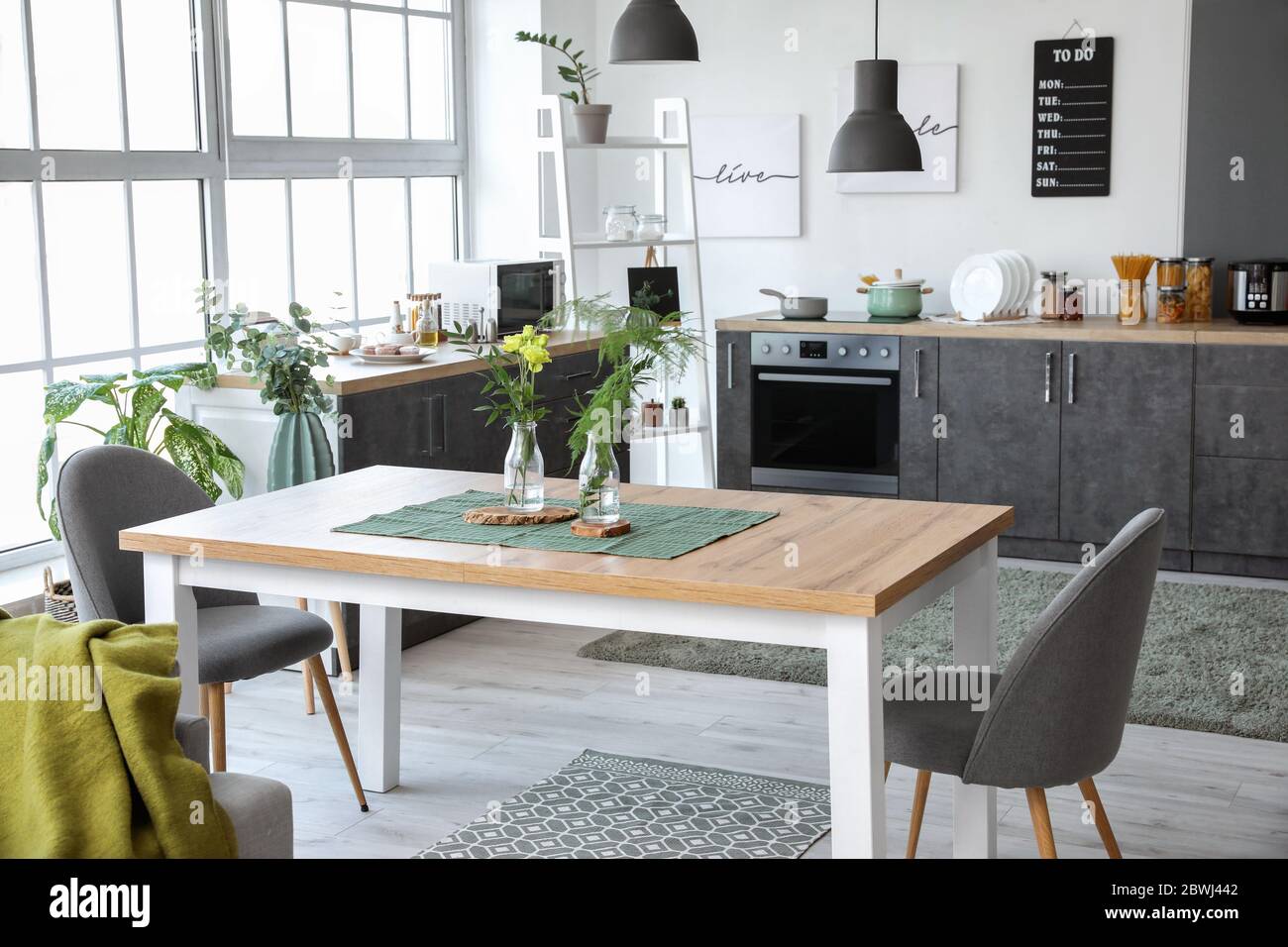 Interior of modern stylish dining room with floral decor Stock Photo ...