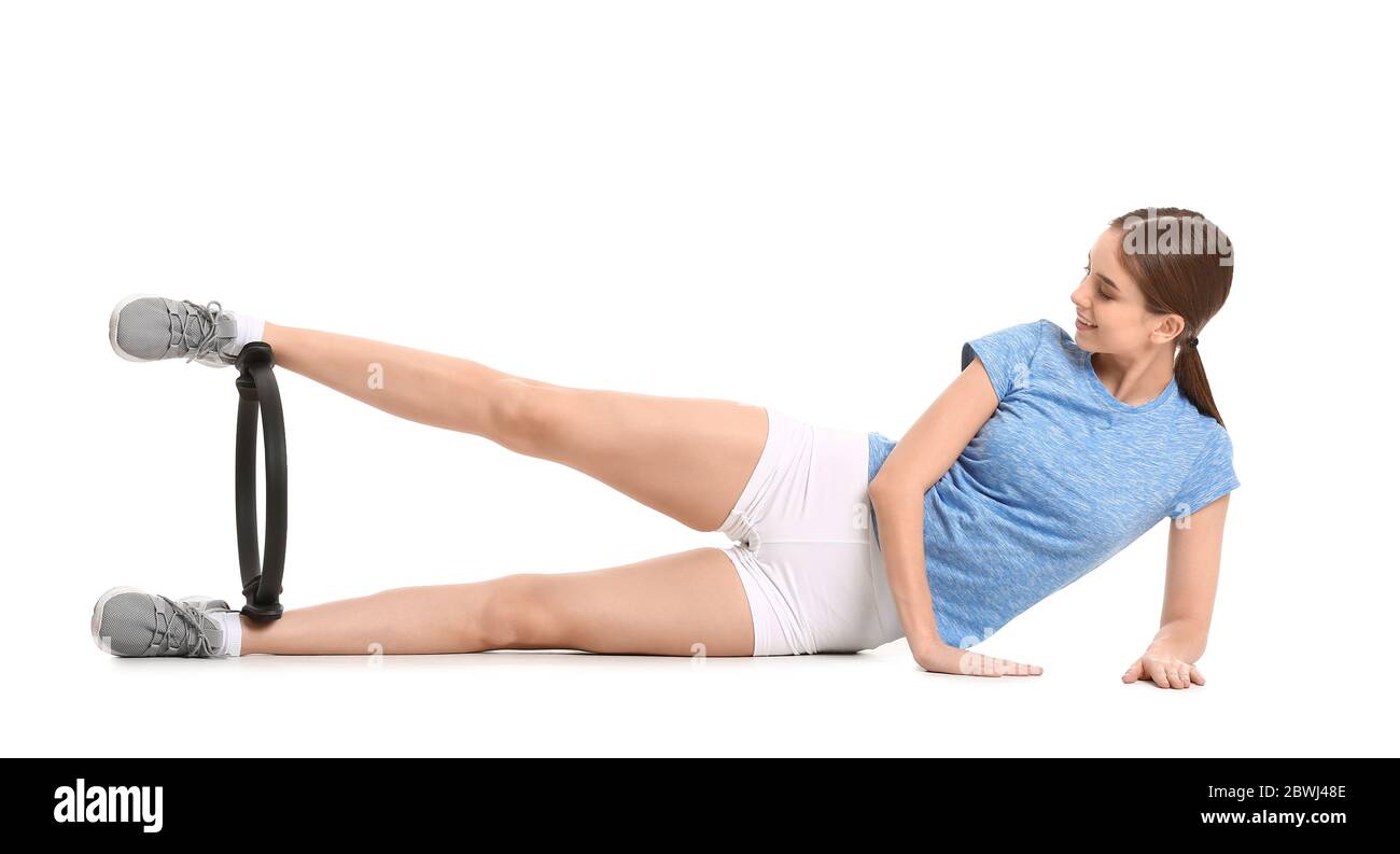 Sporty young woman training against white background Stock Photo - Alamy