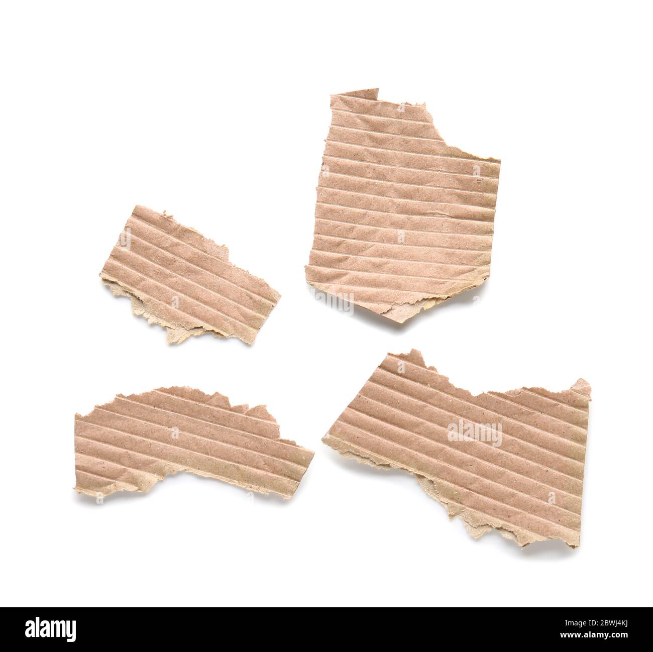 Pieces of cardboard on white background Stock Photo - Alamy