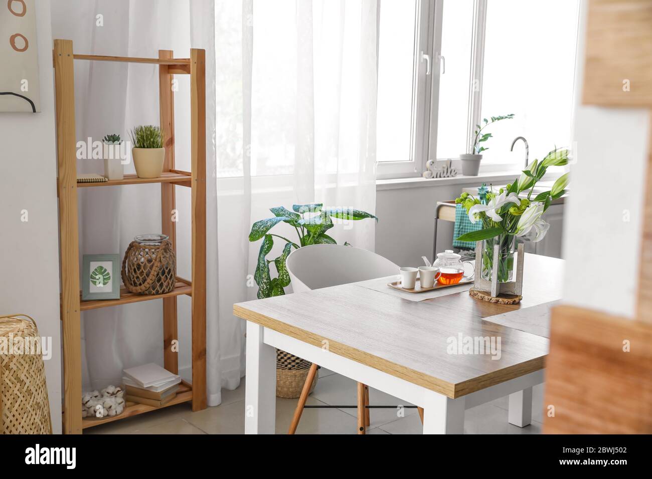 Interior of modern stylish dining room with floral decor Stock Photo ...