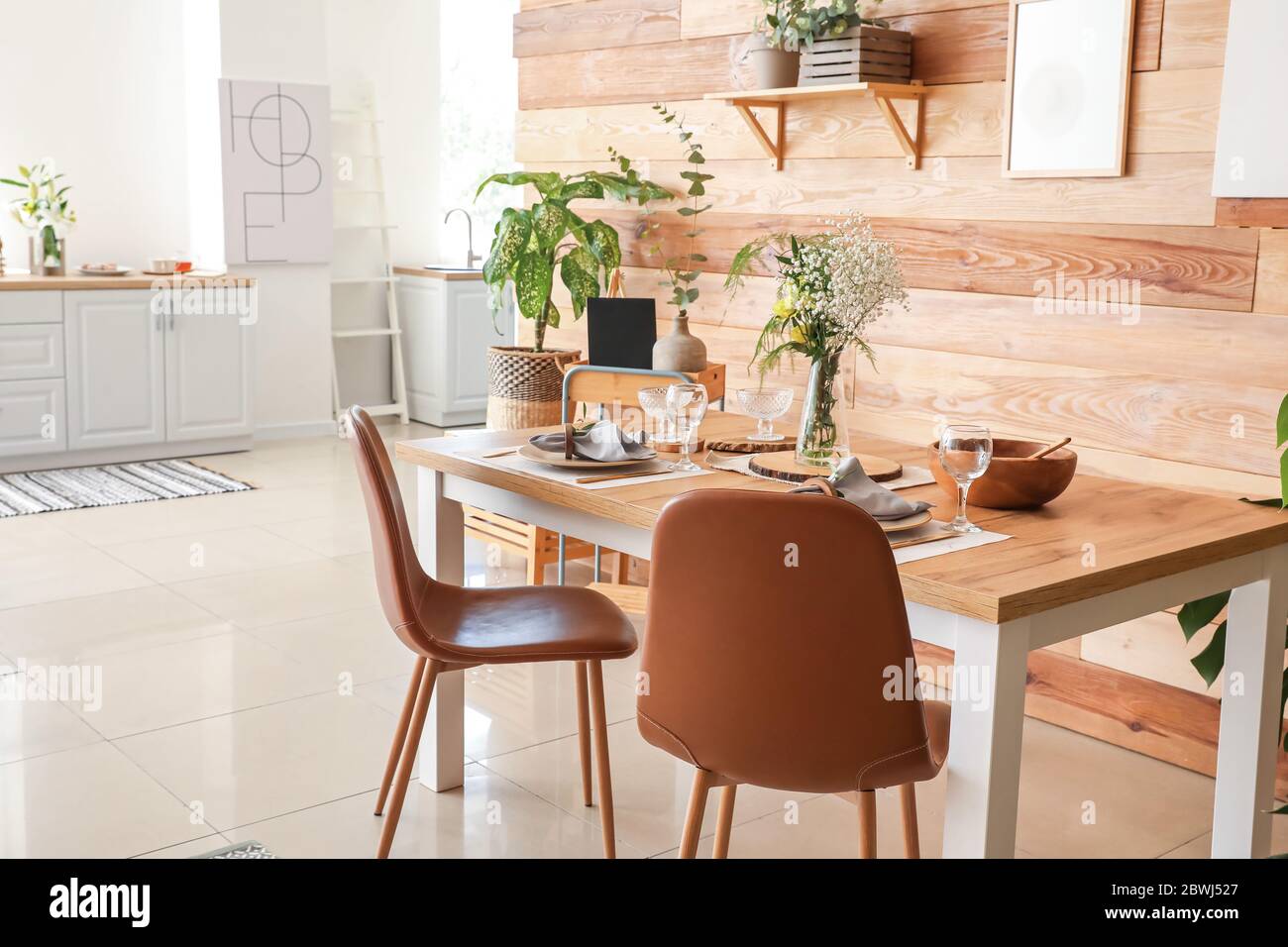 Interior of modern stylish dining room with floral decor Stock Photo ...