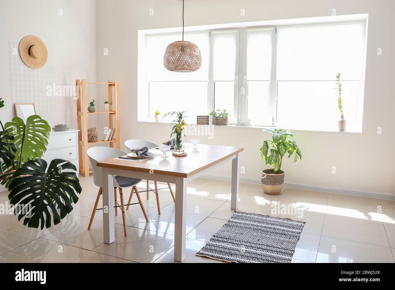Interior of modern stylish dining room with floral decor Stock Photo ...