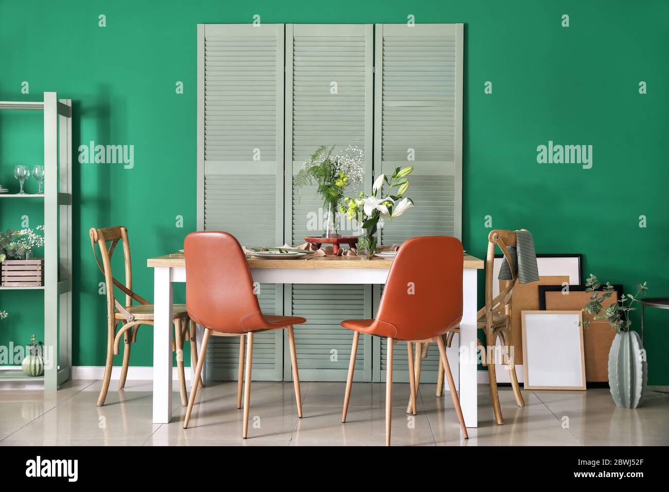 Interior of modern stylish dining room with floral decor Stock Photo ...
