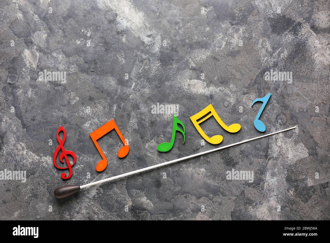 Note symbols and conductor's stick on grunge background Stock Photo Alamy