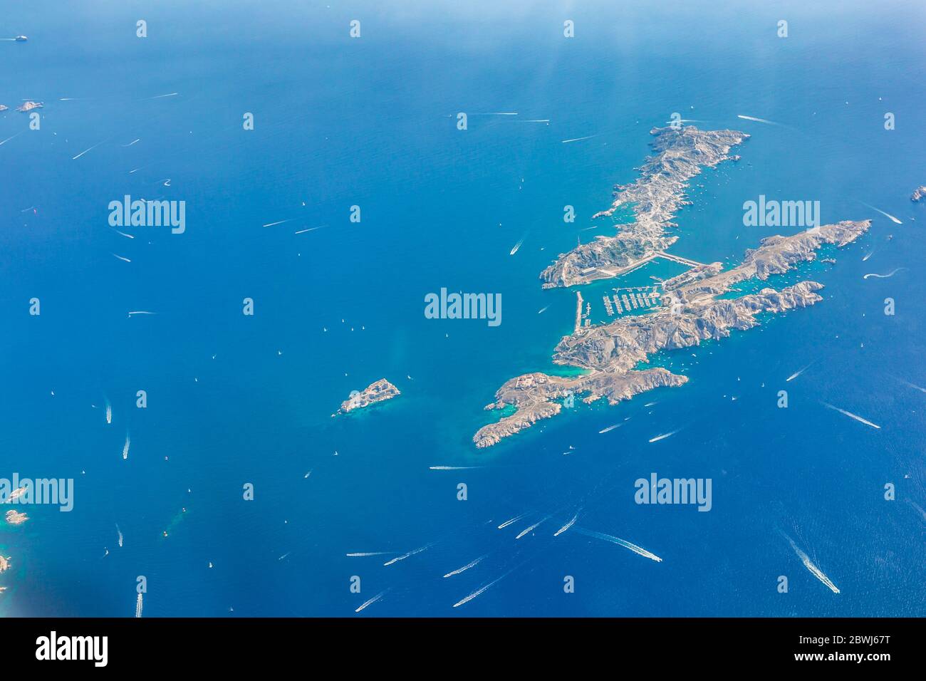 Aerial drone shot view of yachts between Ile Sainte Marguerite and Ile Saint Honorat in mediterranean sea Stock Photo