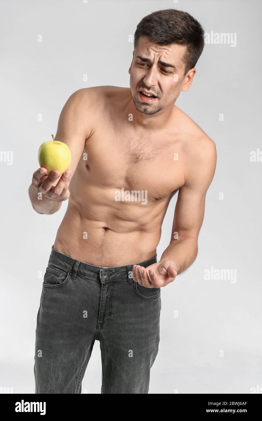 anorexic grannys Sick man with apple on color background. Concept of anorexia Stock Photo -  Alamy