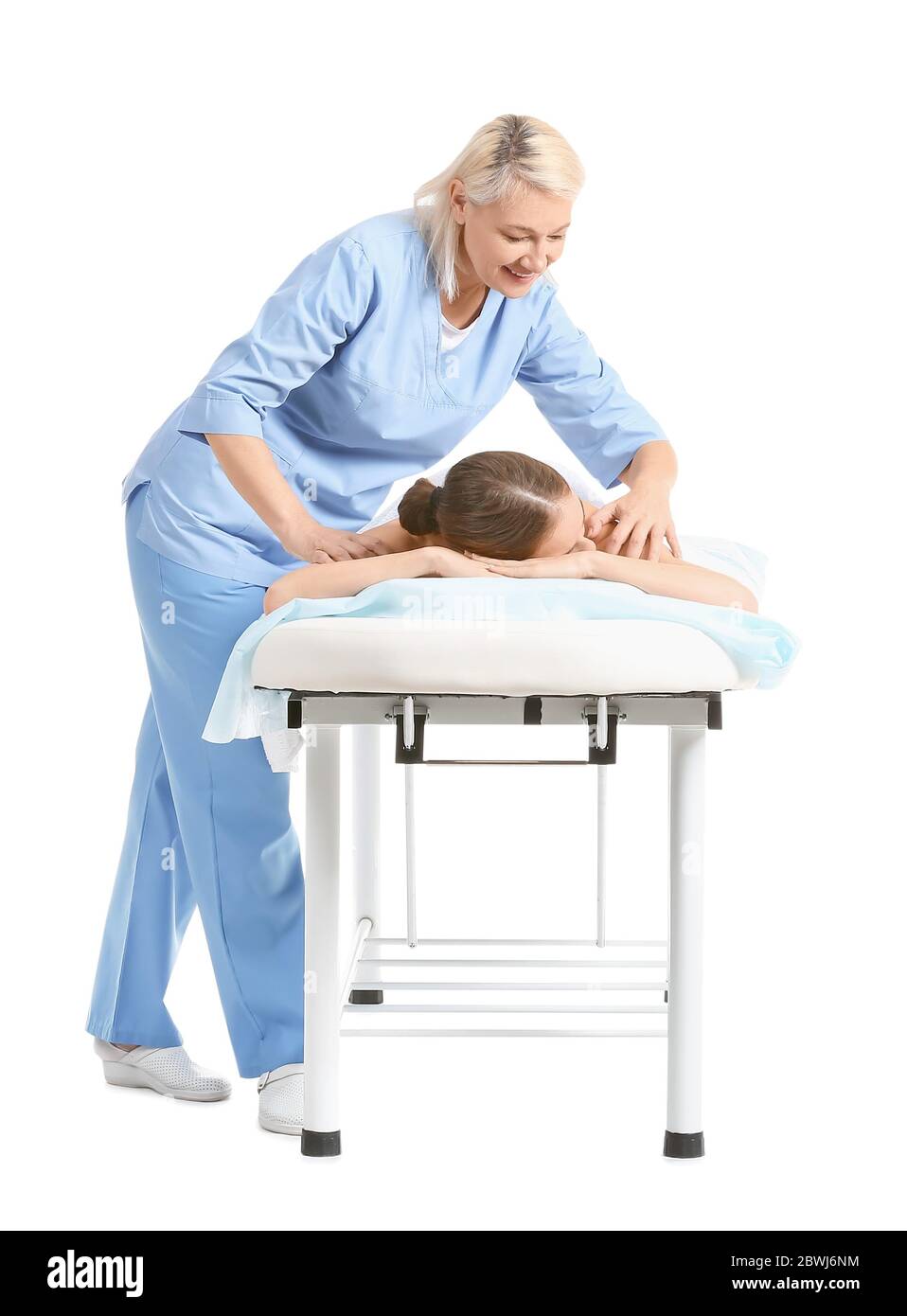 Massage Therapist Working With Female Patient On White Background Stock