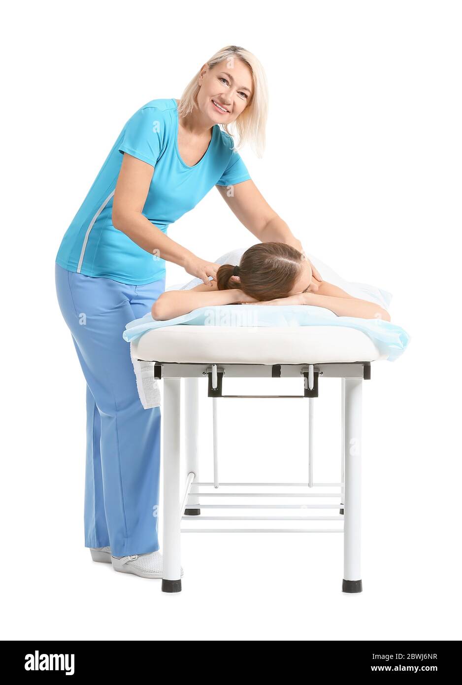 Massage Therapist Working With Female Patient On White Background Stock