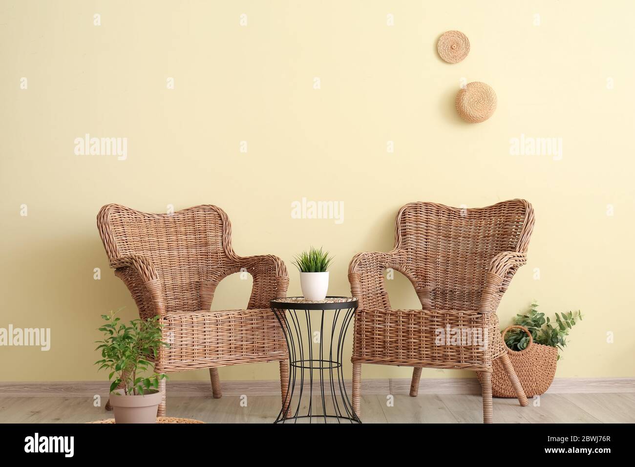 Interior of modern living room with wicker furniture Stock Photo - Alamy
