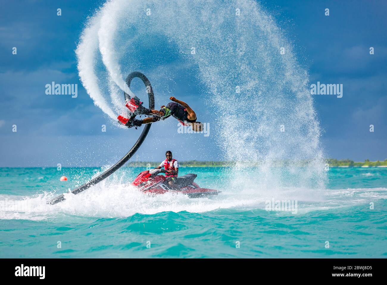 Professional pro fly board rider in tropical sea, water sports concept