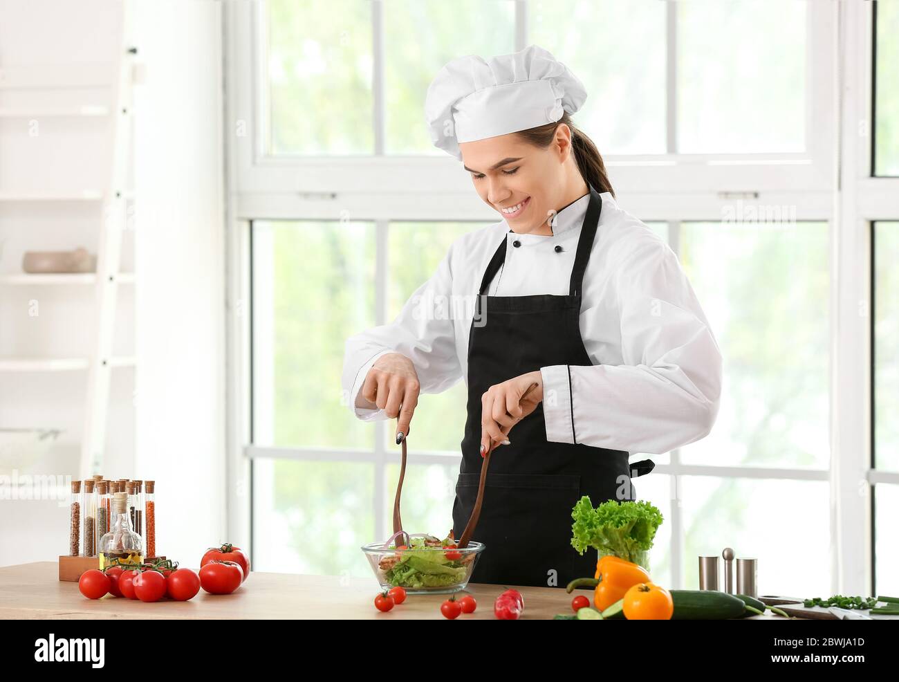 Transgender chef making salad in kitchen Stock Photo - Alamy