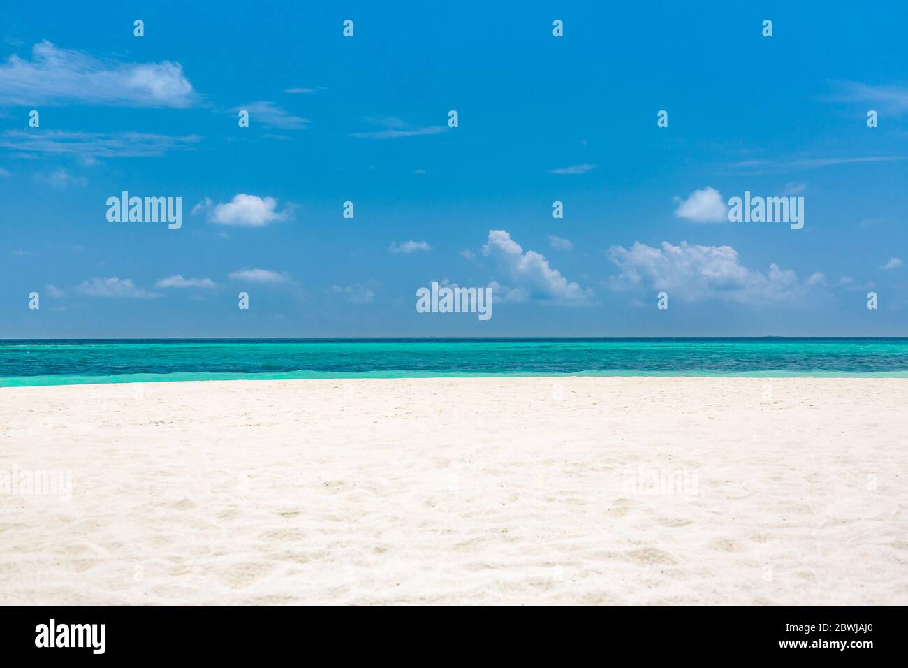 Summer beach background. Sand and sea and sky Stock Photo - Alamy