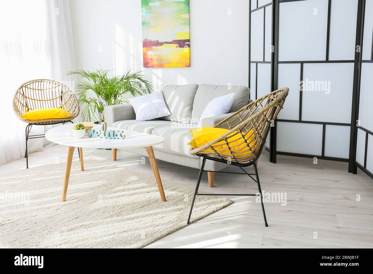 Interior of modern room with comfortable sofa Stock Photo - Alamy