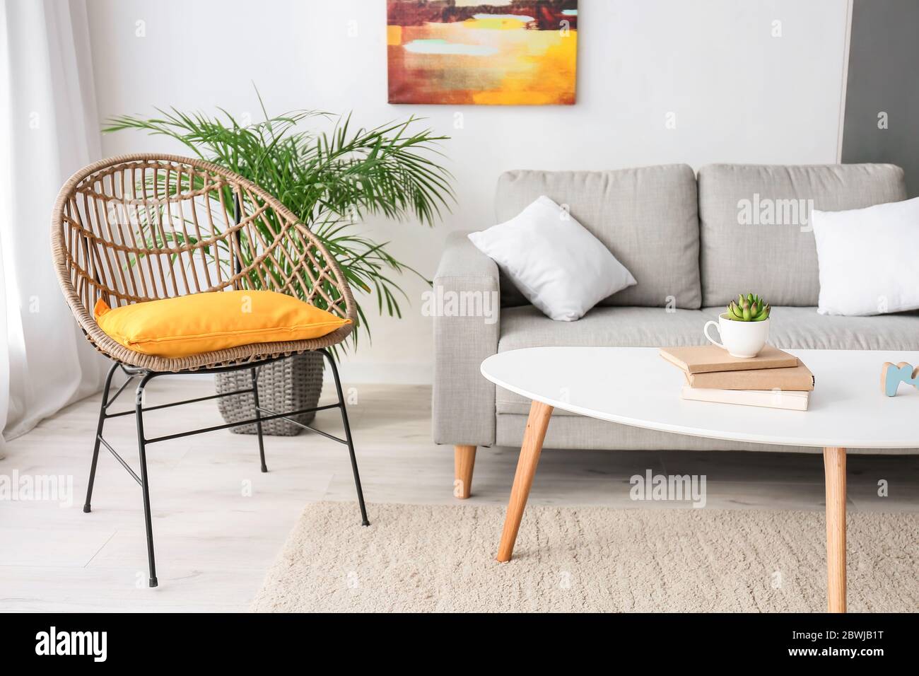 Interior of modern room with comfortable sofa Stock Photo - Alamy