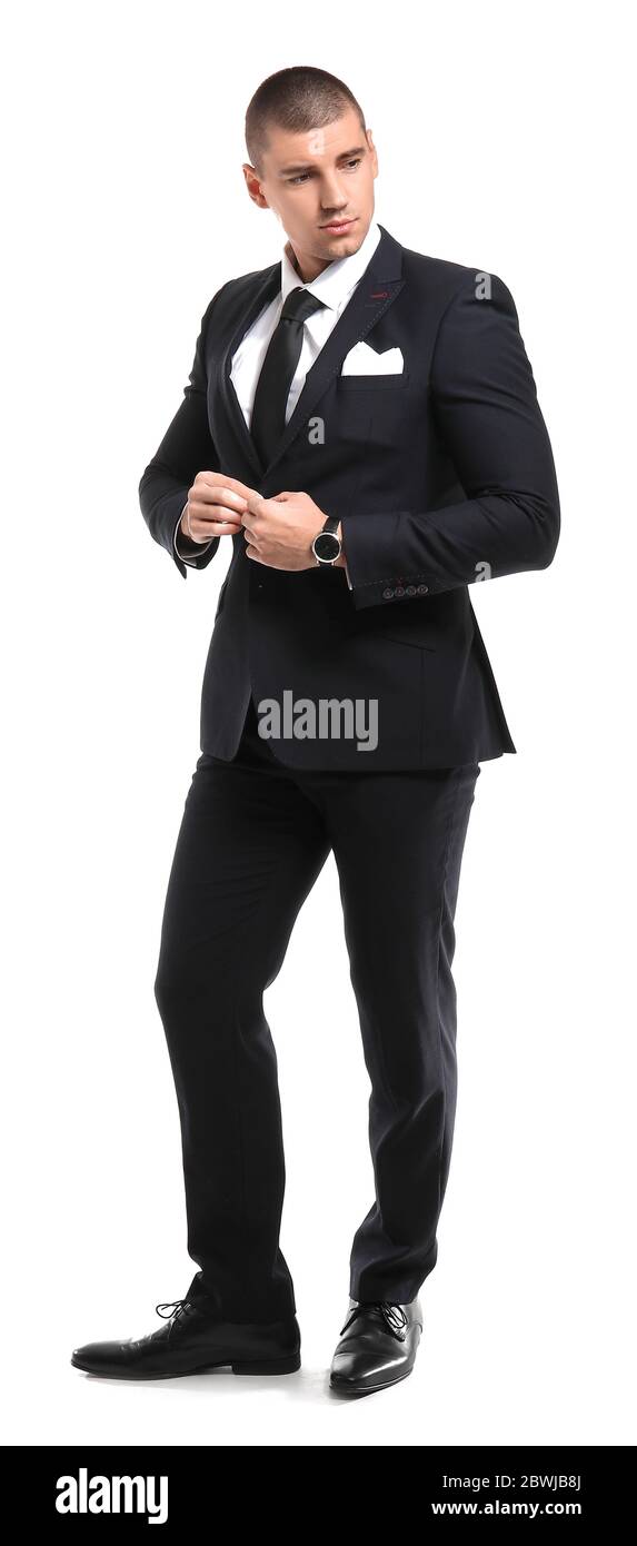 Handsome young man in elegant suit on white background Stock Photo - Alamy