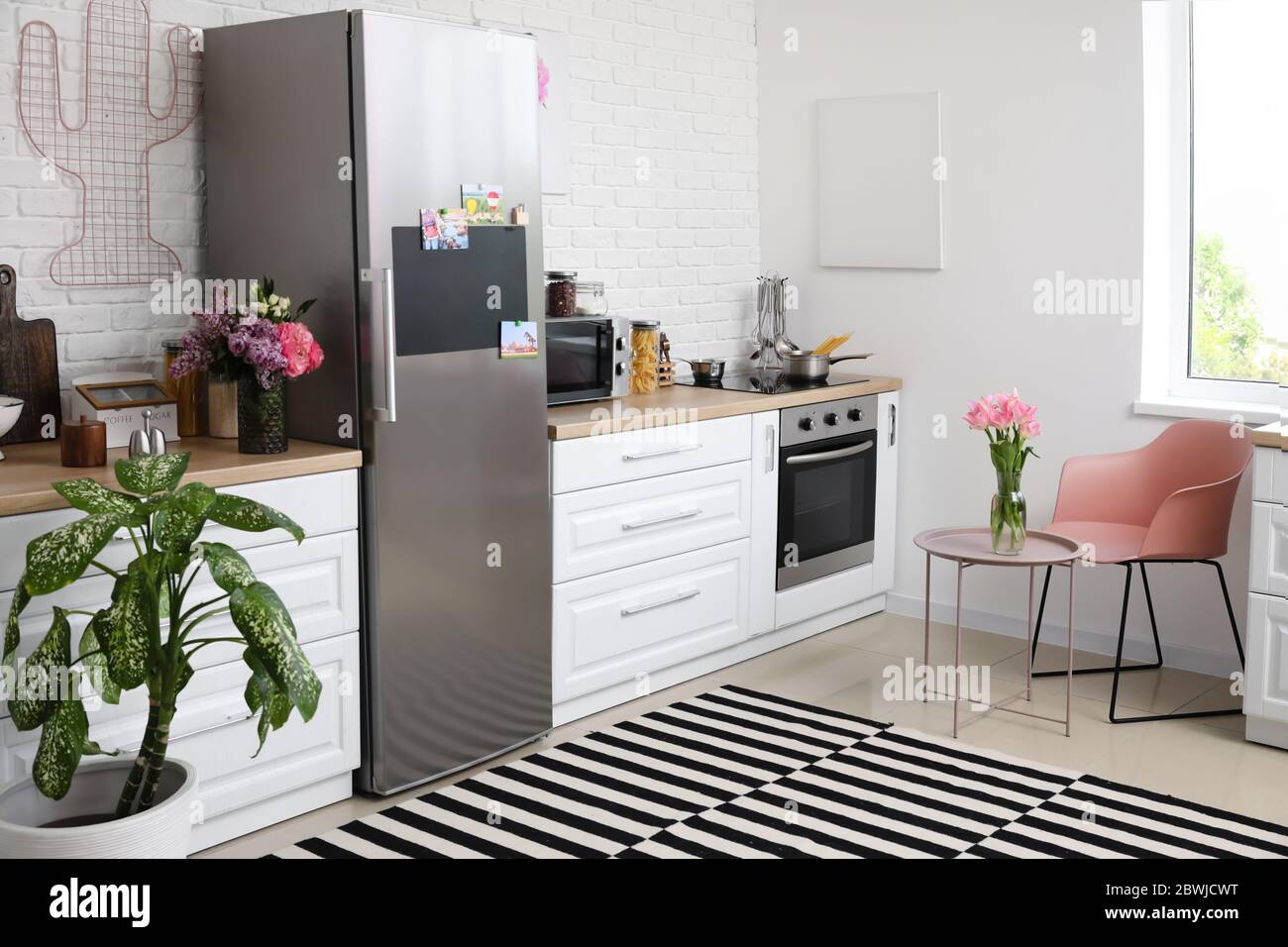 Stylish interior of modern kitchen with big refrigerator Stock Photo ...