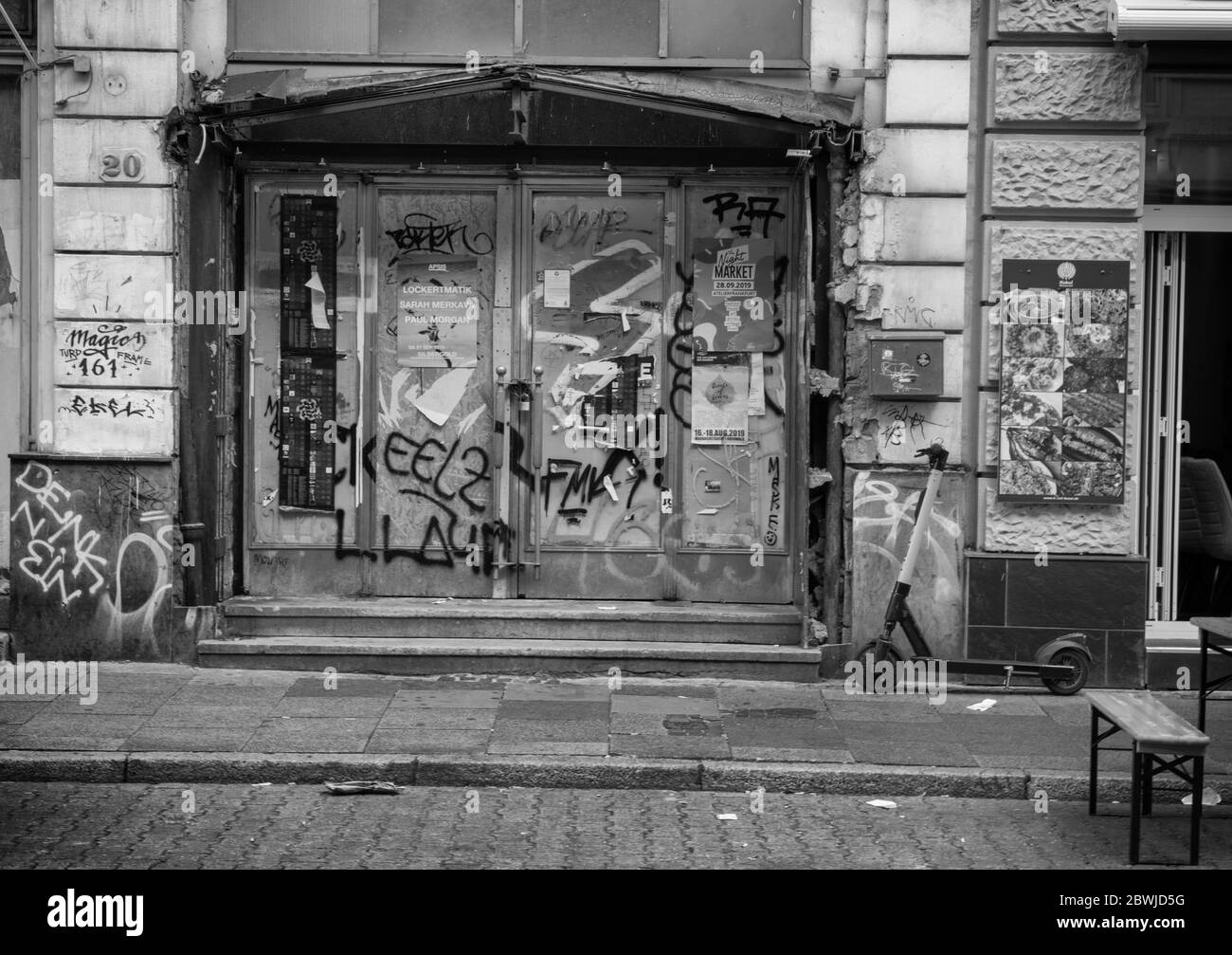 monochrome image of an unkempt door in an empty building, Frankfurt, Germany Stock Photo