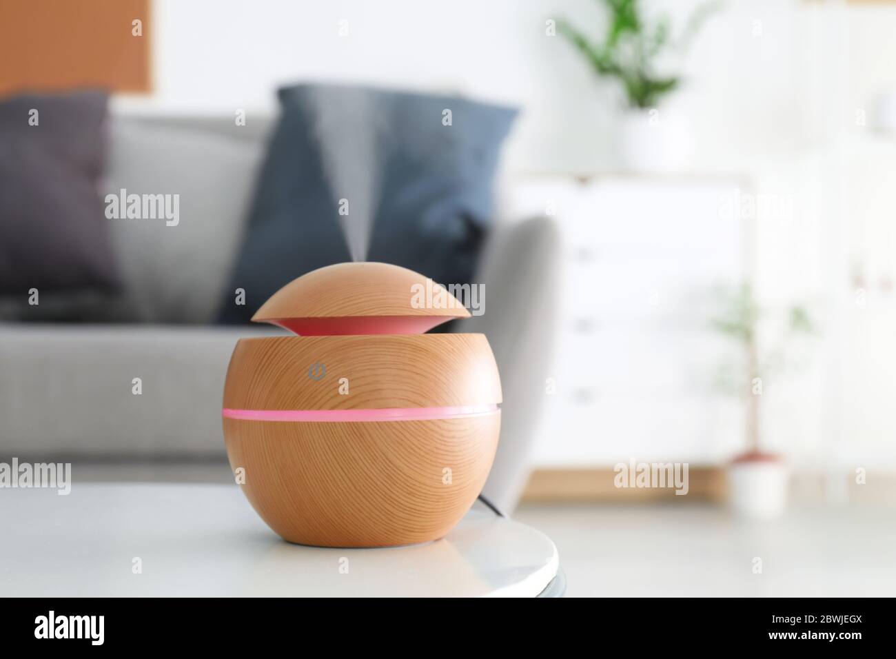Aroma oil diffuser on table in room Stock Photo - Alamy