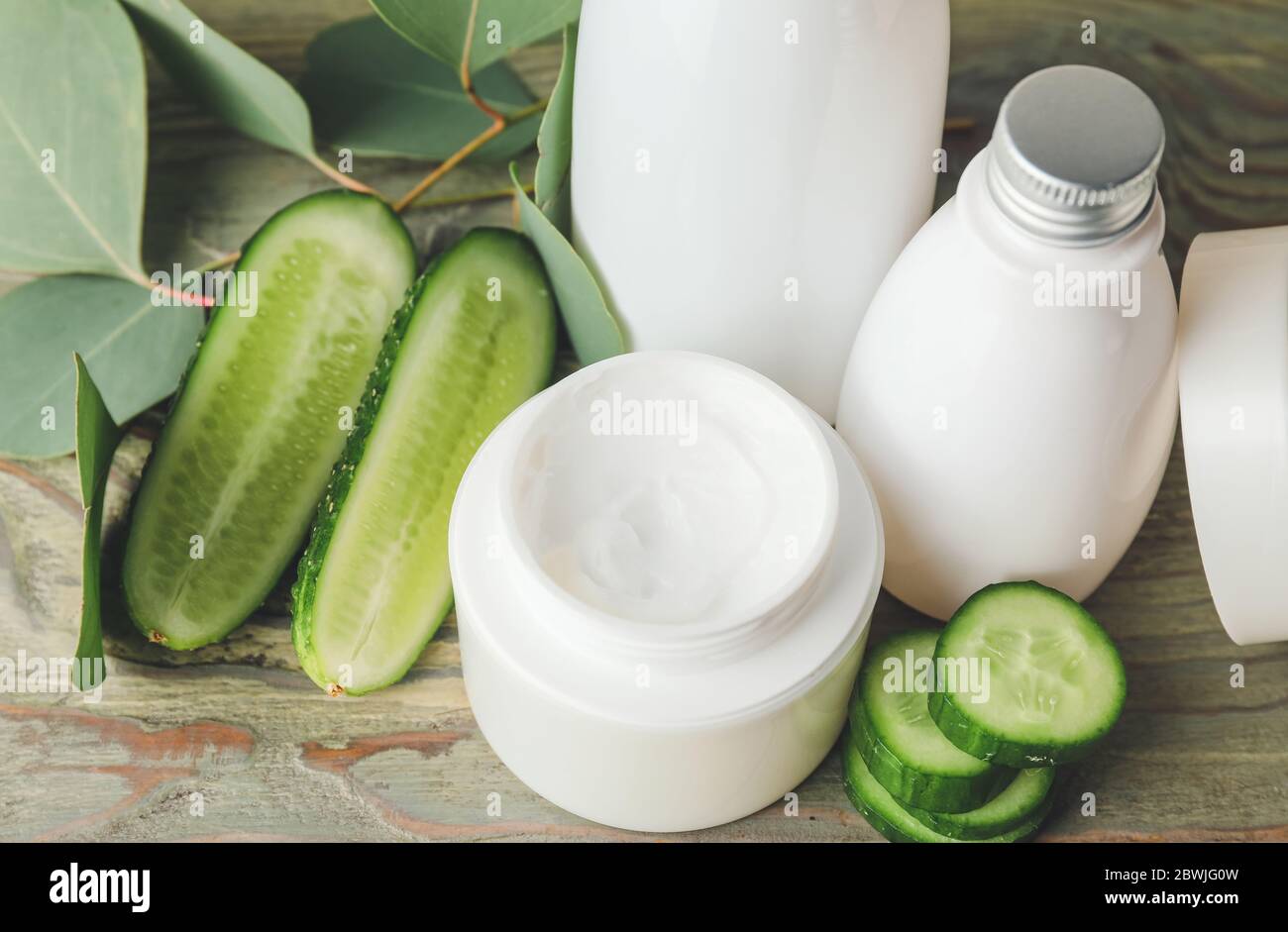 Cosmetics with cucumber extract on table Stock Photo - Alamy