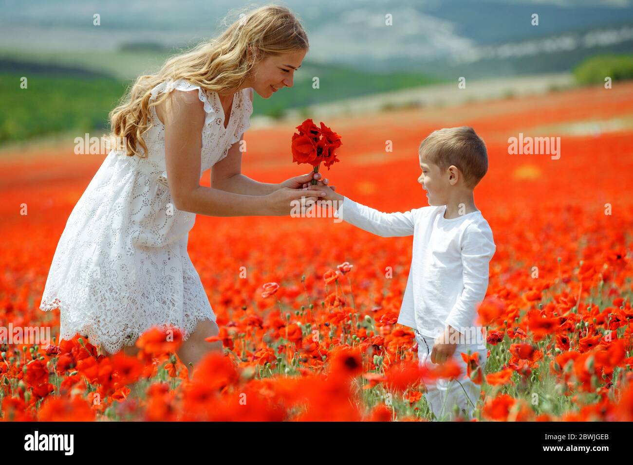 Boy giving flower mother latino hires stock photography and images Alamy