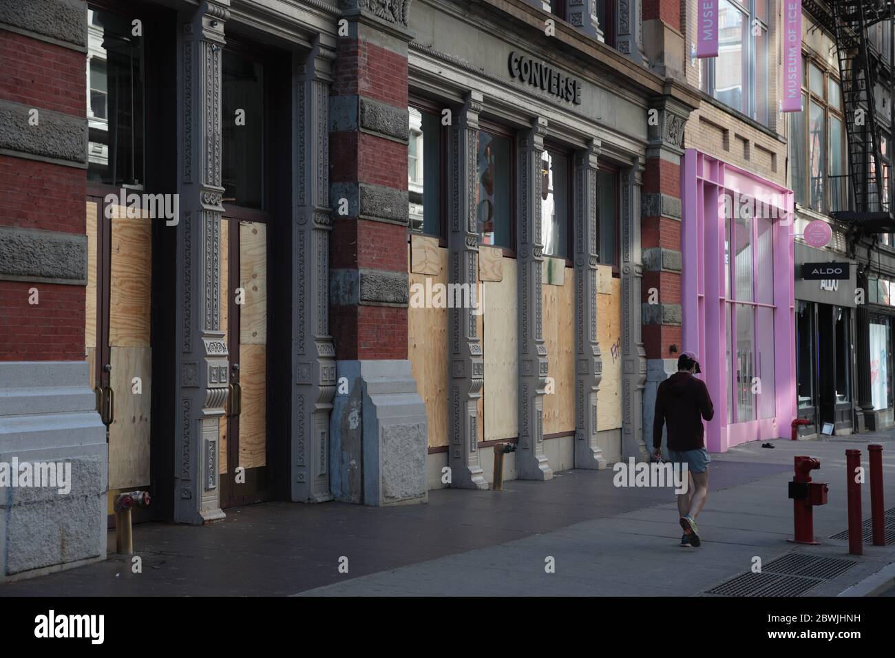 New York, NY, USA - June 1, 2020: Shop windows boarded up on Broadway and Prince Street in New York City after 2 nights of looting Stock Photo