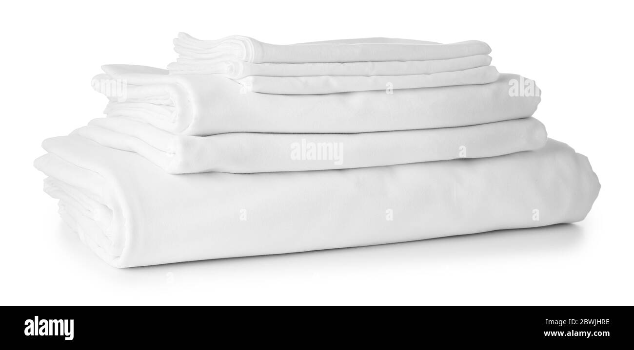 Stack of clean bed sheets on white background Stock Photo Alamy