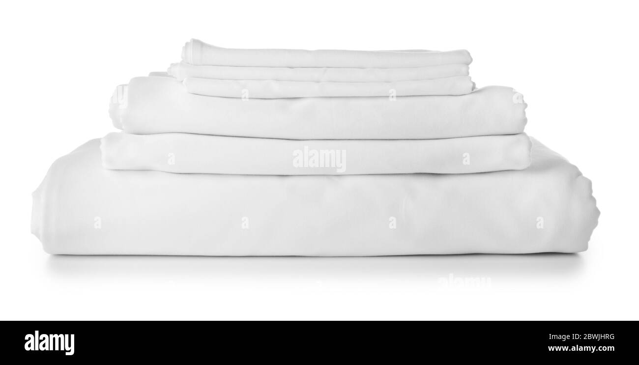 Stack of clean bed sheets on white background Stock Photo Alamy