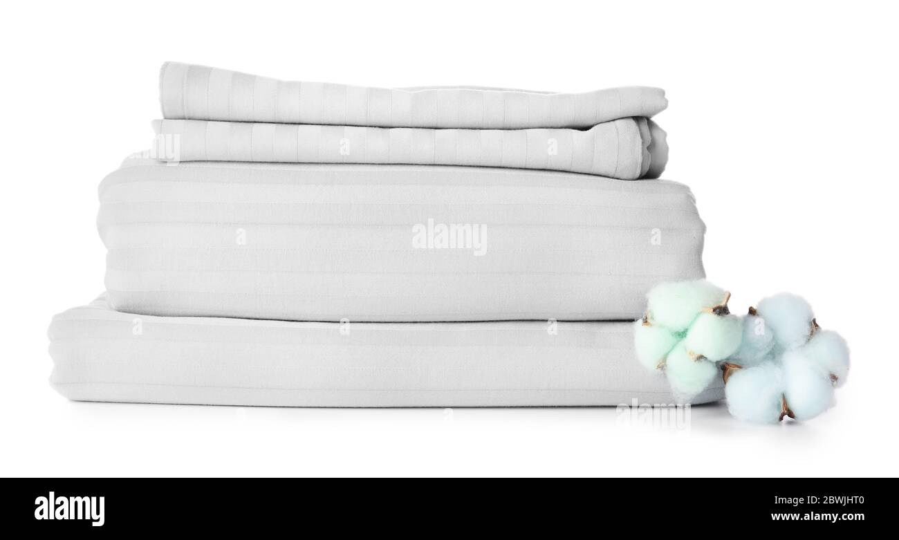 Stack of clean bed sheets on white background Stock Photo - Alamy