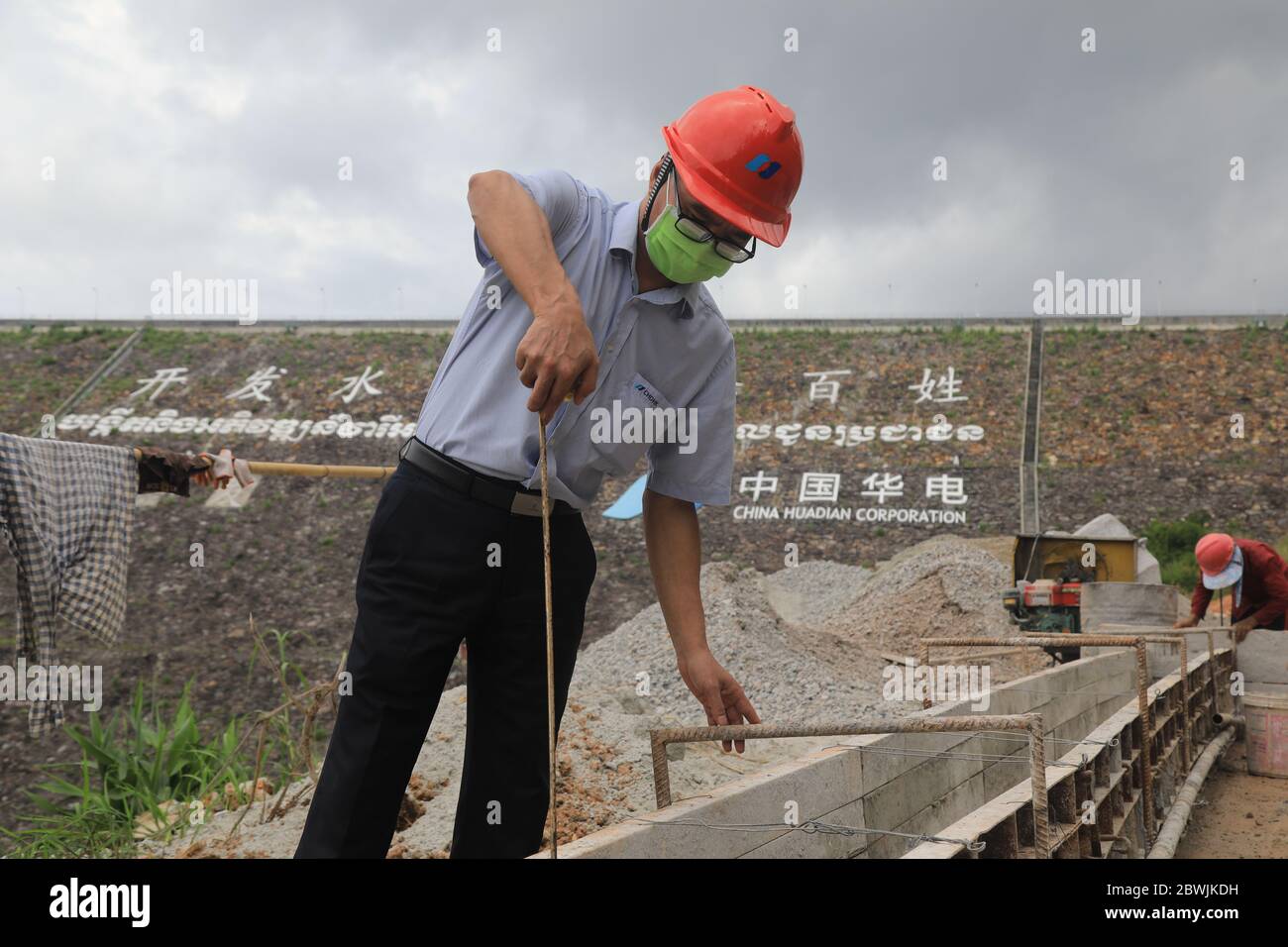 (200602) -- BEIJING, June 2, 2020 (Xinhua) -- Luo Jianhua, deputy director of the production technology department of the Chinese-built lower Stung Russei Chrum hydropower plant, works at a dam in Cambodia's southwestern Koh Kong province, May 23, 2020. TO GO WITH XINHUA HEADLINES OF JUNE 2, 2020 (China Huadian Lower Stung Russei Chrum Hydroelectric Project (Cambodia) Company Limited/Handout via Xinhua) Stock Photo