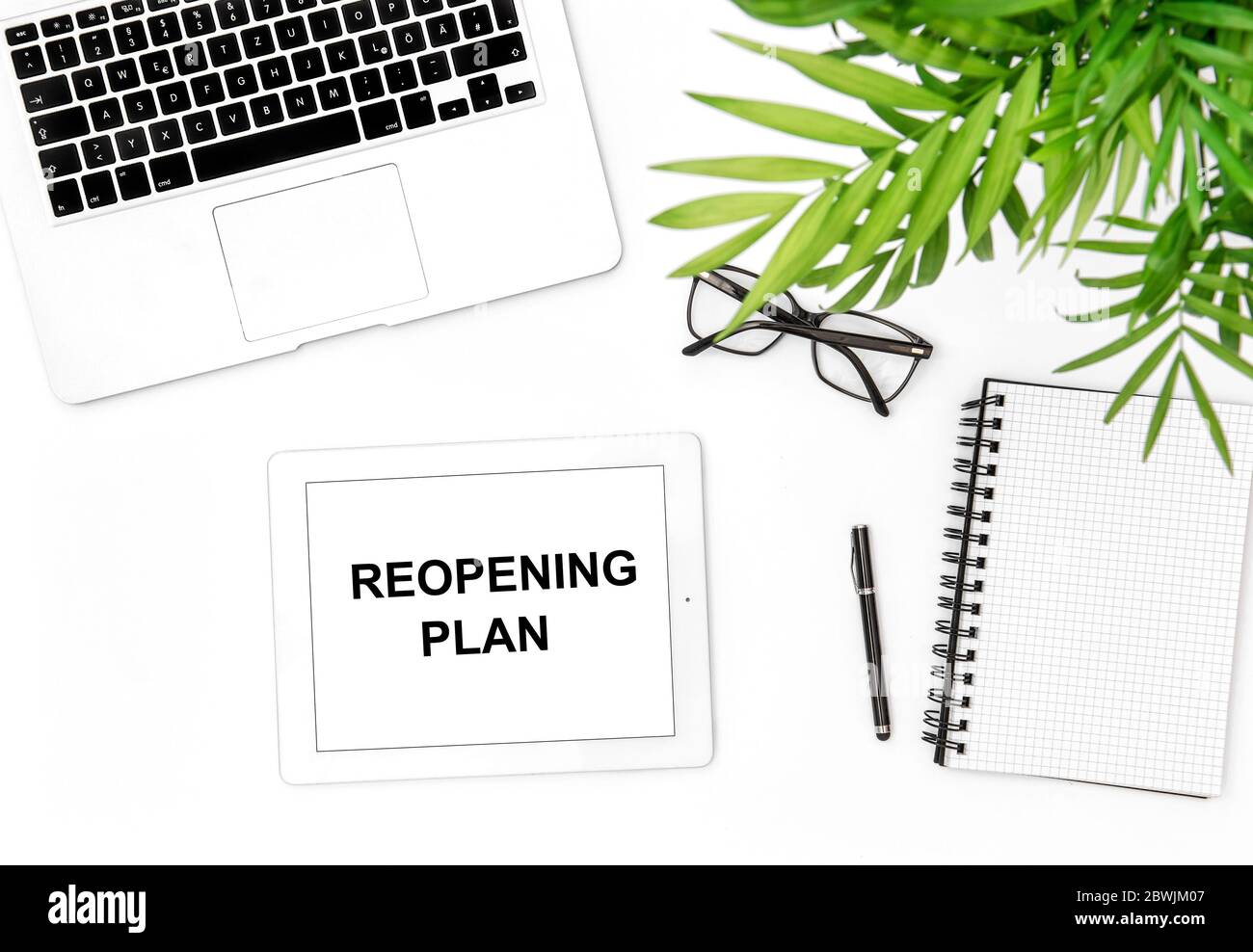 Reopening plan concept. Office workplace flat lay. Laptop, tablet pc, notebook Stock Photo