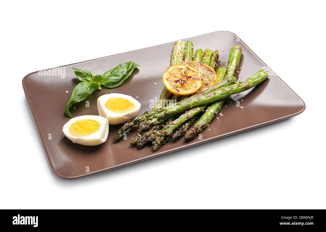 Cooked asparagus with egg and lemon on white background Stock Photo - Alamy - Boiling Asparagus And Eggs With Lemon