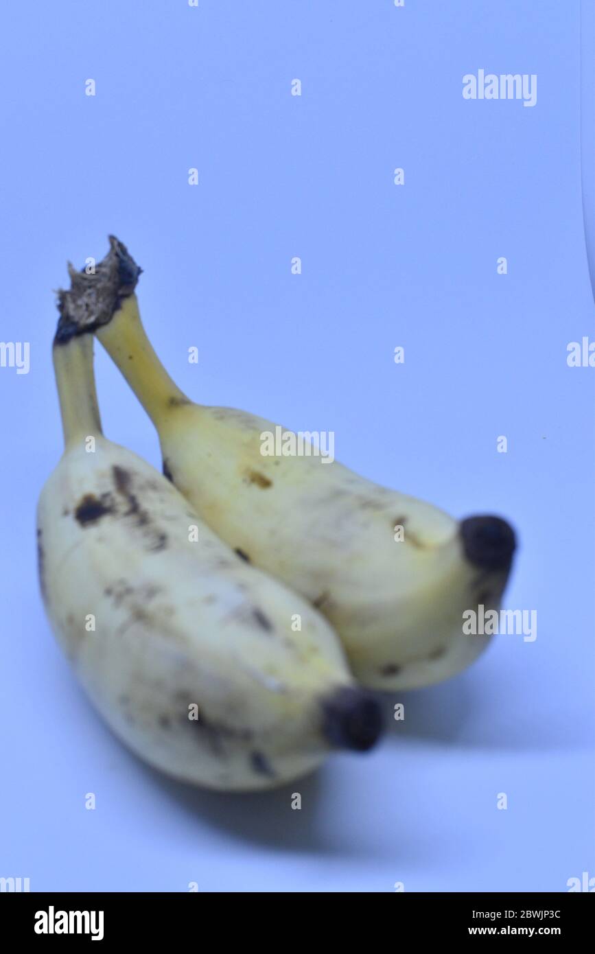 Cheru pazham or Njalipoovan (a variety of small banana fruit) against a
