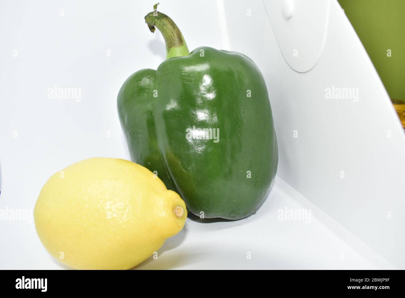 Capsicum and lemon isolated on white background Stock Photo - Alamy