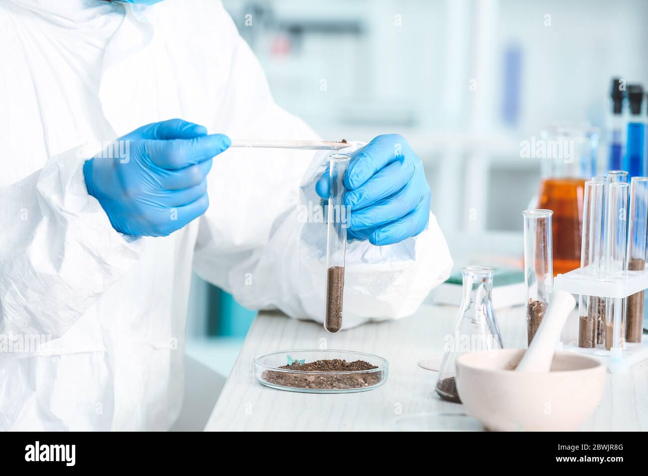 Scientist studying samples of soil in laboratory Stock Photo - Alamy