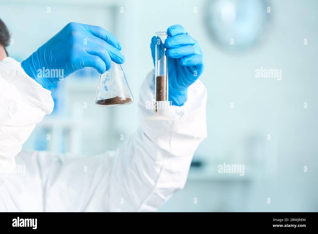 Scientist studying samples of soil in laboratory Stock Photo - Alamy