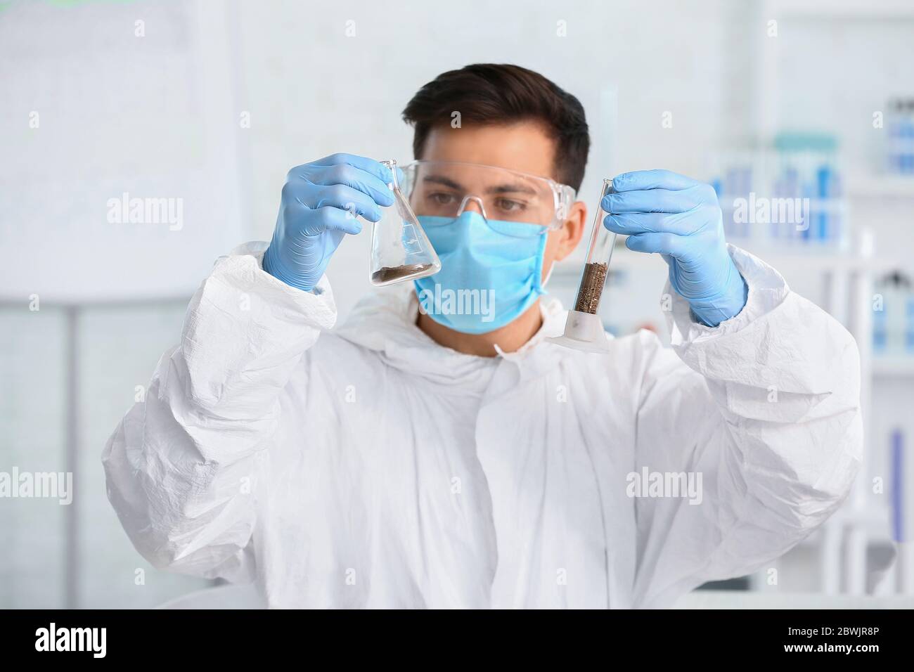 Scientist studying samples of soil in laboratory Stock Photo - Alamy