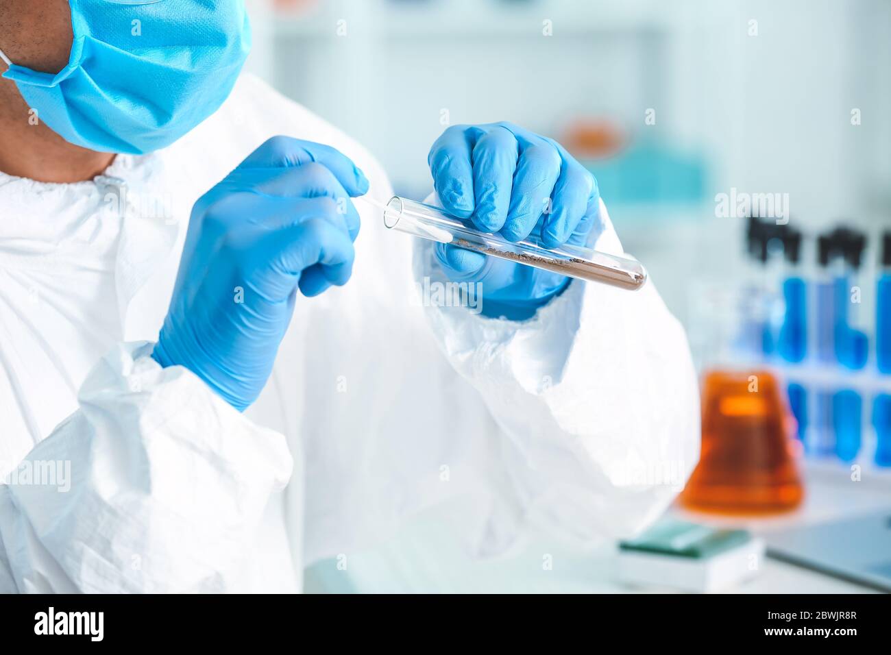 Scientist studying samples of soil in laboratory Stock Photo - Alamy