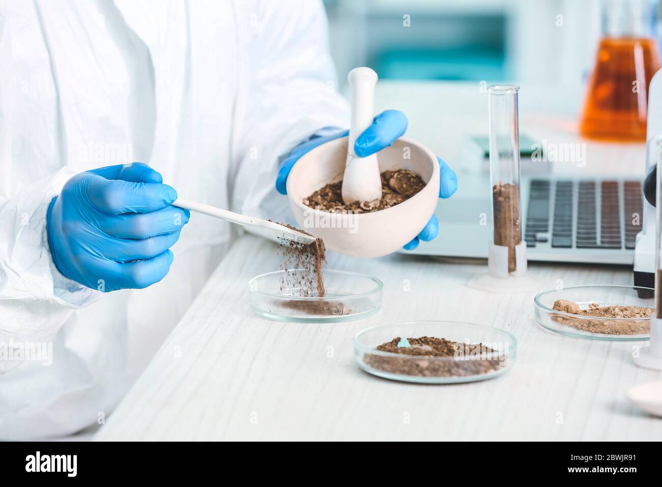 Scientist studying samples of soil in laboratory Stock Photo - Alamy