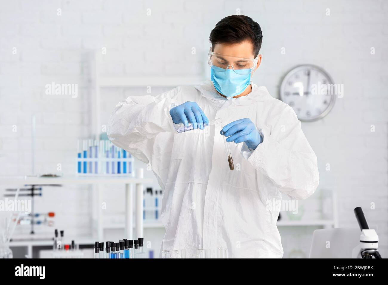 Scientist studying samples of soil in laboratory Stock Photo - Alamy