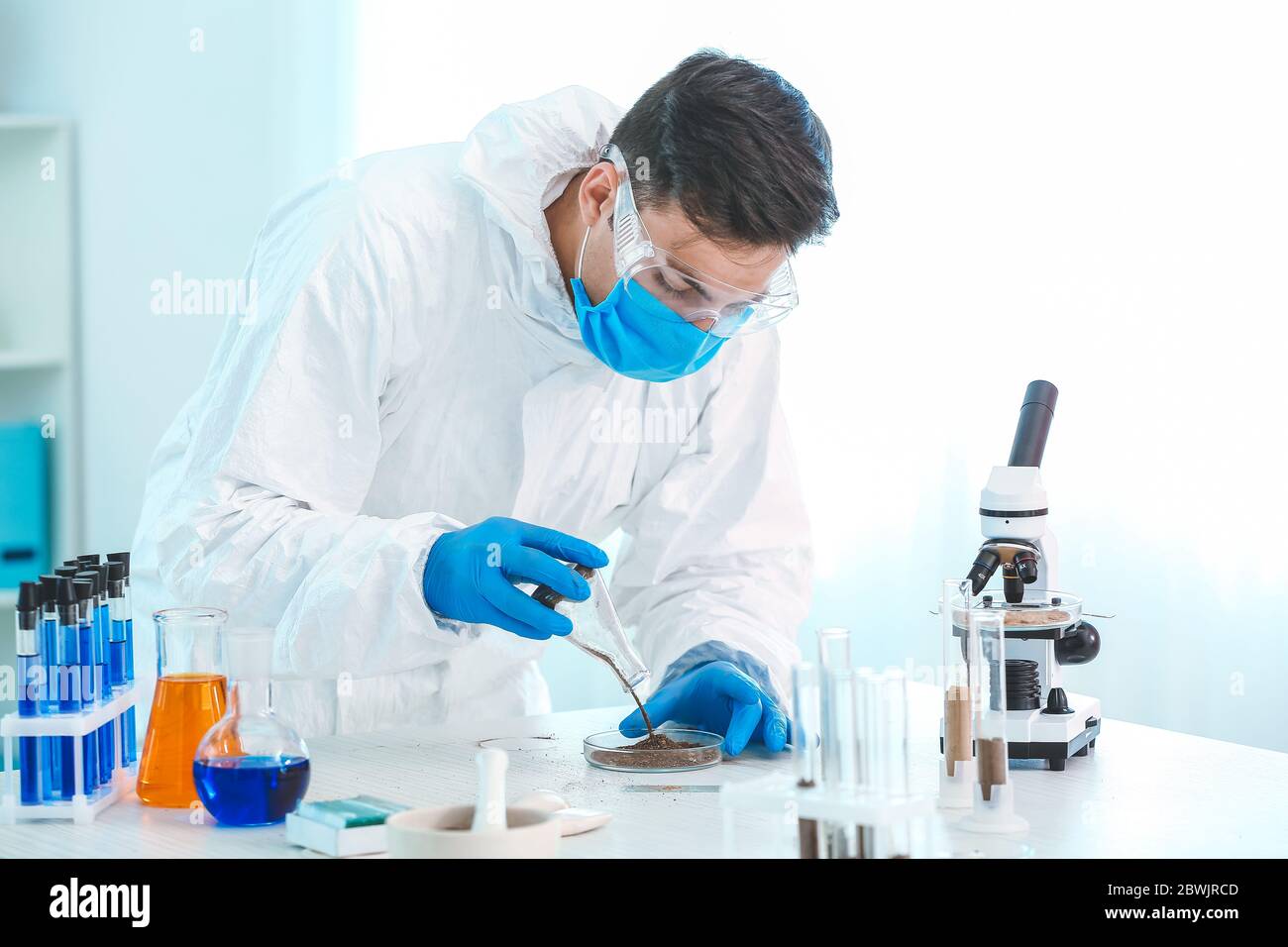 Scientist studying samples of soil in laboratory Stock Photo - Alamy