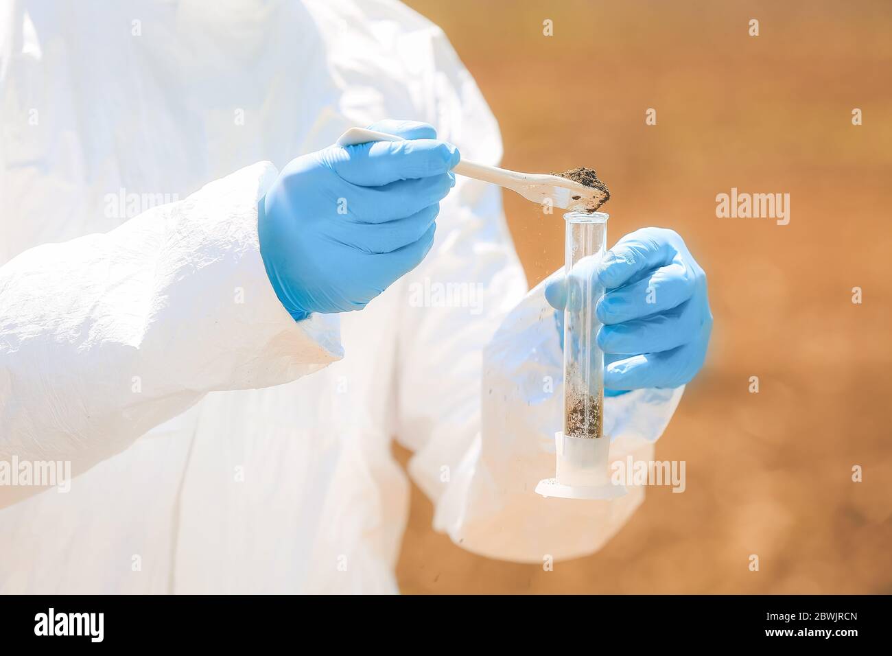 Scientist studying samples of soil in field, closeup Stock Photo - Alamy