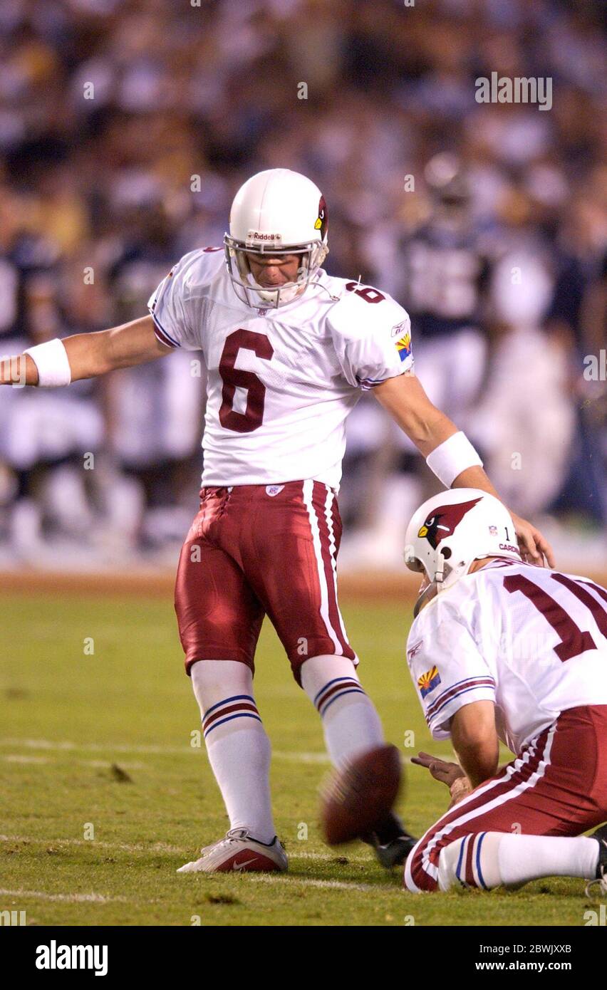 San Diego, United States. 16th Aug, 2003. Arizona Cardinals place kicker  Tim Duncan kicks an extra point out of hold of Scott Player. The Cardinals  defeated the Chargers, 16-10, in the NFL